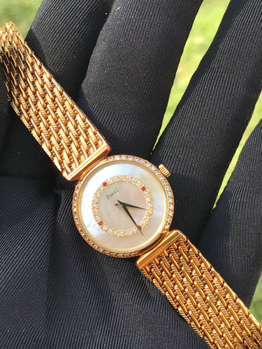 1980s vintage Piaget Yellow Gold, Mother of Pearl, Diamond & Rubies