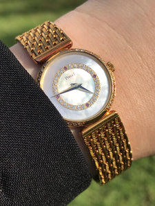 1980s vintage Piaget Yellow Gold, Mother of Pearl, Diamond & Rubies